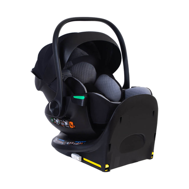 mountain buggy protect infant car seat capsule on isofix base with sunhood and handle extended in three quarter view on a white background