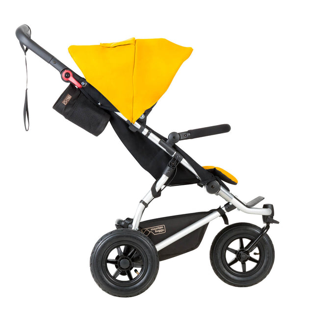 mountain buggy swift compact buggy toddler side view shown in color gold_gold