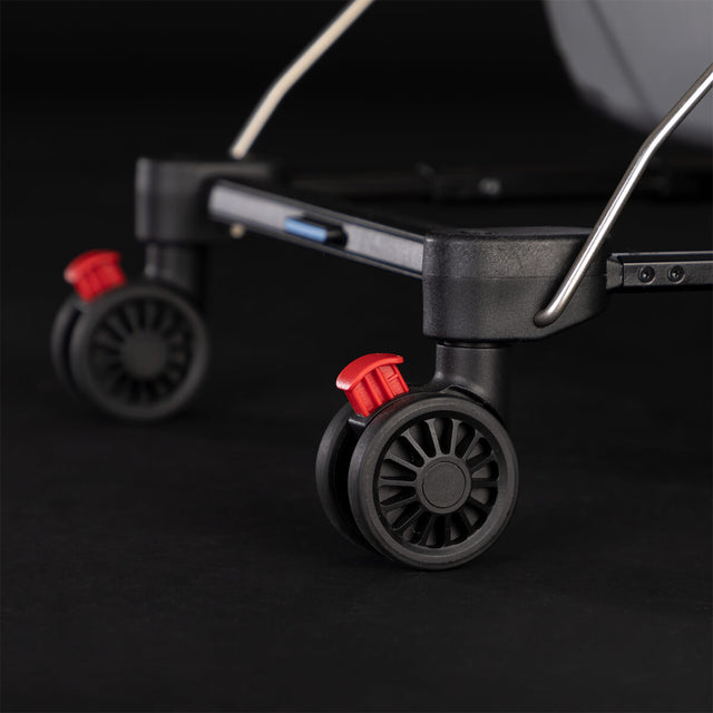 Mountain Buggy skyrider luxury close up of rear wheel brakes with red brake lever to show peace of mind for easy brake access_silver