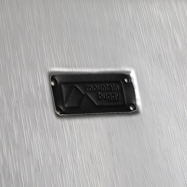 Mountain Buggy skyrider luxury close up of the premium luxury branding in leather_silver