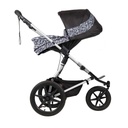 Mountain Buggy carrycot plus on terrain in parent facing seat mode in colour graphite_graphite
