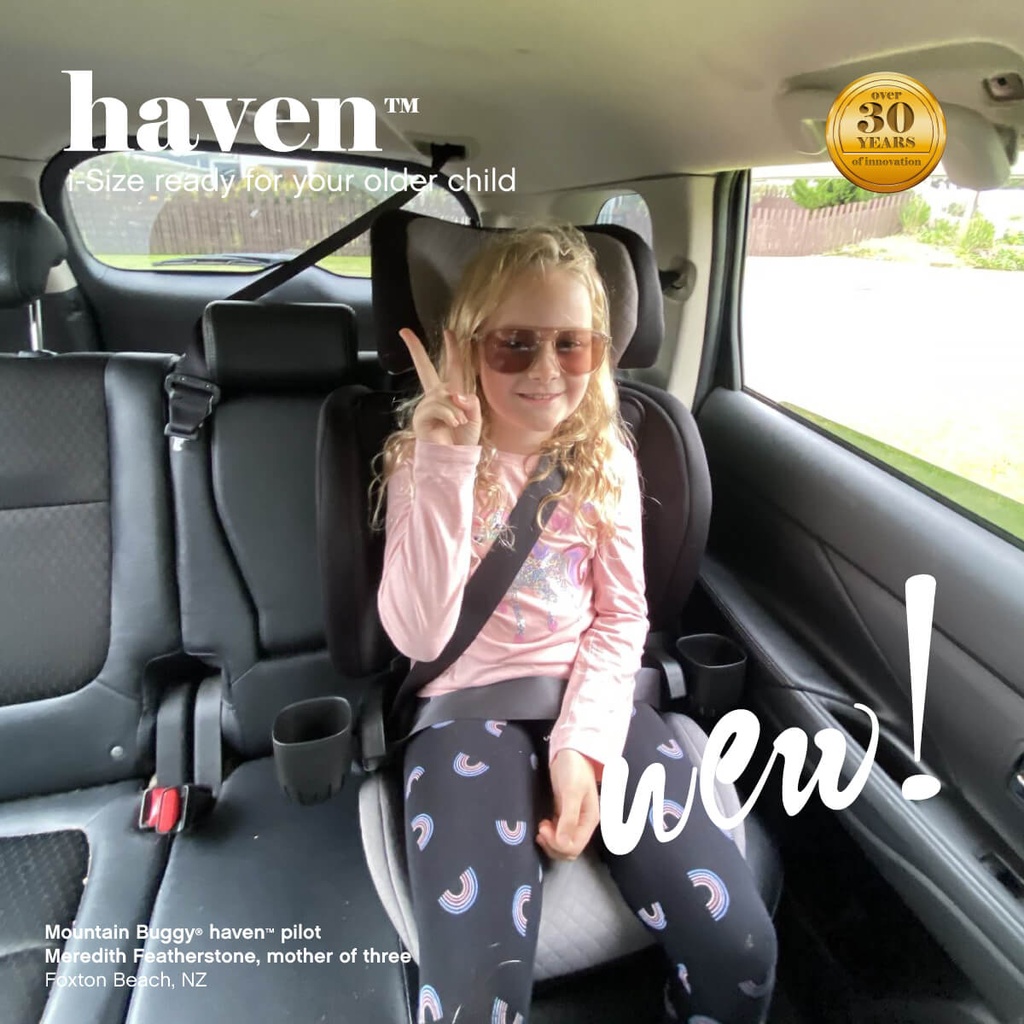 cool kid safely belted into the haven i-Size car seat booster - Mountain Buggy haven pilot Meredith Featherstone, mother of three, Foxton Beach, New Zealand