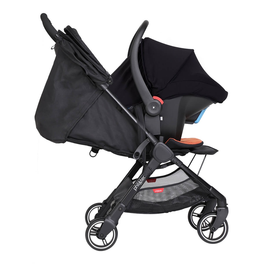 alpha infant car seat shown as a travel system using optional travel adaptors on a phil&teds go buggy