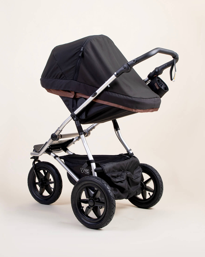 mountain-buggy-carrycot-plus-toddler-seat-Blackoutcover-on-urban-jungle-buggy.webp