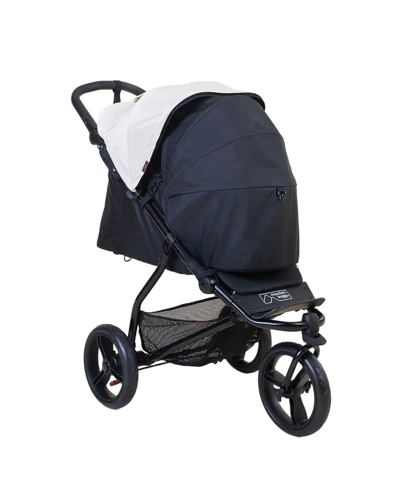 mountain-buggy-cocoon-bassinet-on-swift-buggy-with-hood-3-quarter-view-ivory.webp
